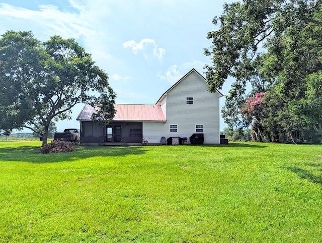 1370 Coach Rd, Slocomb, AL 36375 - back of house featuring a lawn and a metal roof