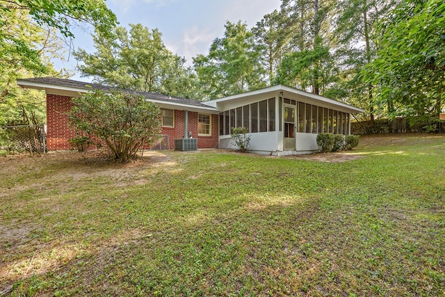 139 Merrydell Dr, Ozark, AL 36360 - back of property featuring a sunroom and brick siding