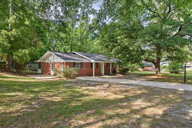 139 Merrydell Dr, Ozark, AL 36360 - ranch-style house with concrete driveway, a front yard, and brick siding