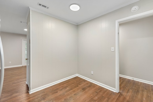 139 Merrydell Dr, Ozark, AL 36360 - spare room featuring a smoke detector, wood finished floors, and ornamental molding