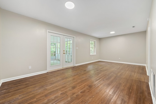 139 Merrydell Dr, Ozark, AL 36360 - spare room featuring french doors and dark wood-type flooring