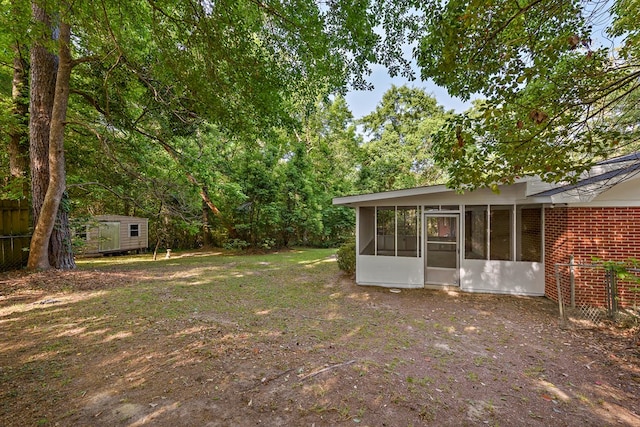 139 Merrydell Dr, Ozark, AL 36360 - view of yard with a sunroom and a shed