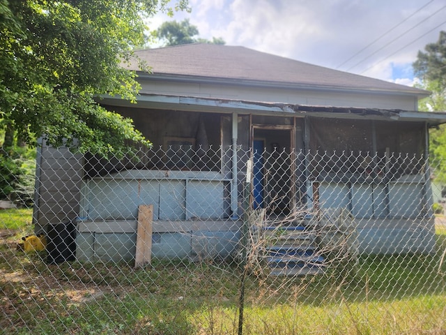 view of side of home with fence