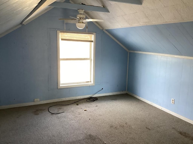additional living space with vaulted ceiling, carpet flooring, and a ceiling fan