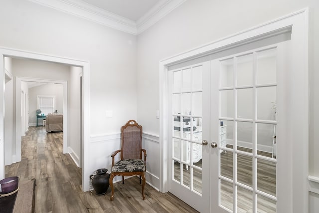 interior space with french doors, ornamental molding, and hardwood / wood-style flooring