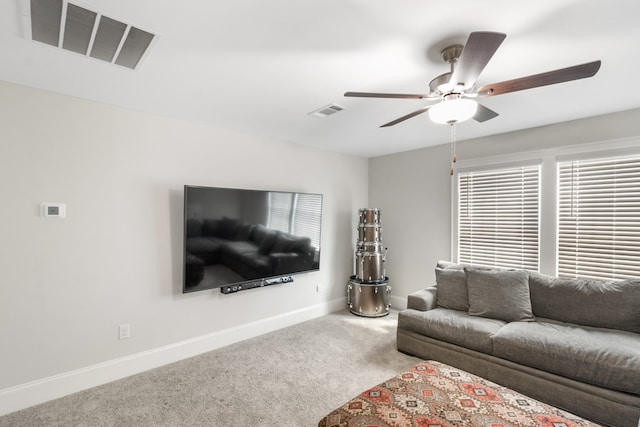 living room featuring ceiling fan and carpet floors