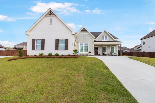 view of front of house featuring a porch and a front yard