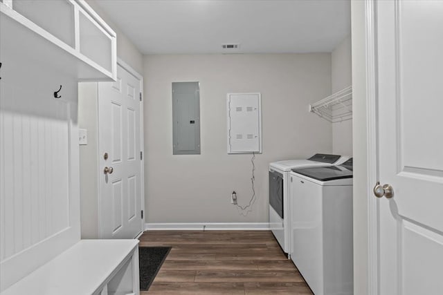 630 Ridgeland Rd, Dothan, AL 36301 - washroom with electric panel, washing machine and clothes dryer, and dark wood finished floors