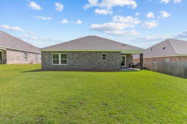 630 Ridgeland Rd, Dothan, AL 36301 - back of house with a patio area, brick siding, and roof with shingles