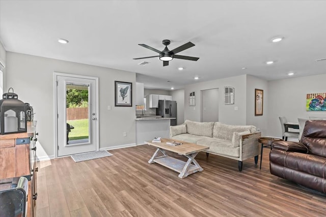 630 Ridgeland Rd, Dothan, AL 36301 - living room featuring light wood-style flooring, a ceiling fan, and recessed lighting
