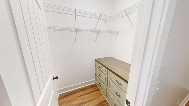 walk in closet featuring light wood-type flooring