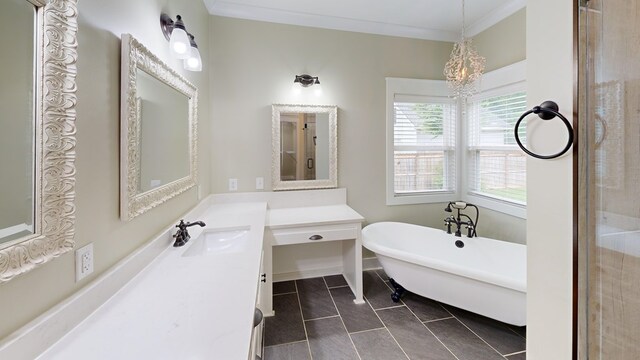 bathroom with tile patterned floors, vanity, crown molding, a bath, and a notable chandelier