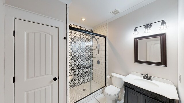 bathroom featuring tile patterned floors, toilet, an enclosed shower, and vanity