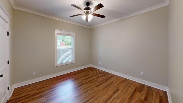 unfurnished room with dark hardwood / wood-style floors, ceiling fan, and ornamental molding