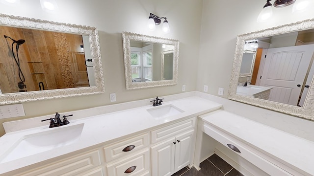 bathroom featuring vanity, tile patterned floors, and walk in shower