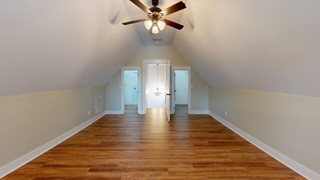 bonus room featuring ceiling fan, hardwood / wood-style floors, and vaulted ceiling