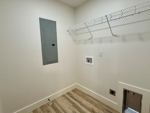 laundry room with electric panel, hardwood / wood-style floors, washer hookup, and hookup for an electric dryer