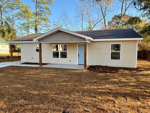 single story home featuring a patio area and a front yard