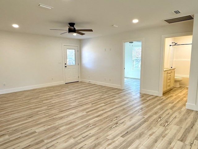 spare room featuring ceiling fan and light hardwood / wood-style floors