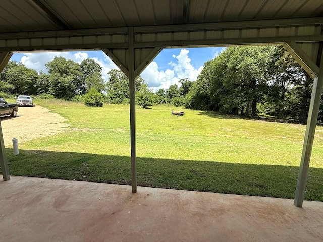 245 County Road 422, Abbeville, AL 36310 - view of green lawn featuring a patio area and view of wooded area