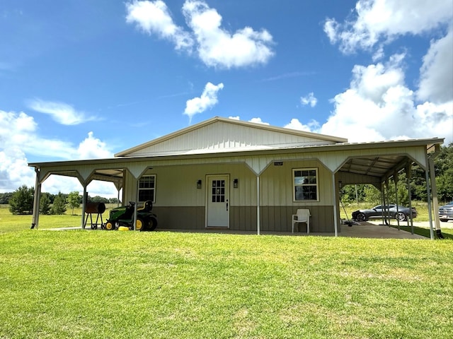 245 County Road 422, Abbeville, AL 36310 - back of house featuring a carport and a lawn