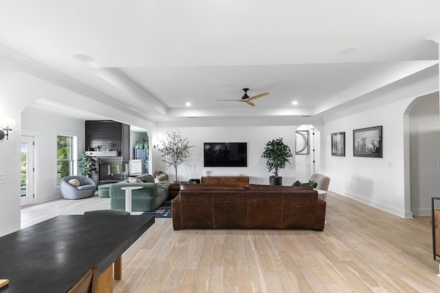481 Grace Dr, Newton, AL 36352 - living area featuring a raised ceiling, arched walkways, ceiling fan, light wood-type flooring, and recessed lighting