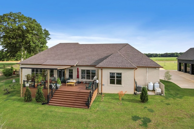 481 Grace Dr, Newton, AL 36352 - back of property featuring roof with shingles, a deck, and a yard
