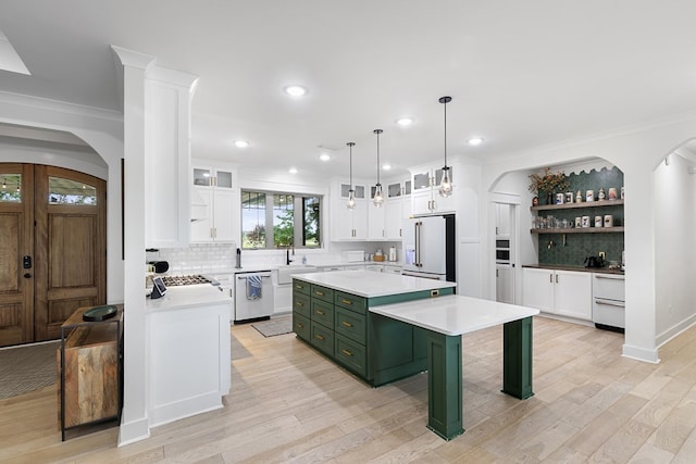 481 Grace Dr, Newton, AL 36352 - kitchen with green cabinets, high end white fridge, dishwasher, white cabinets, and tasteful backsplash