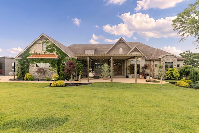 481 Grace Dr, Newton, AL 36352 - back of property with a patio, a yard, and stone siding