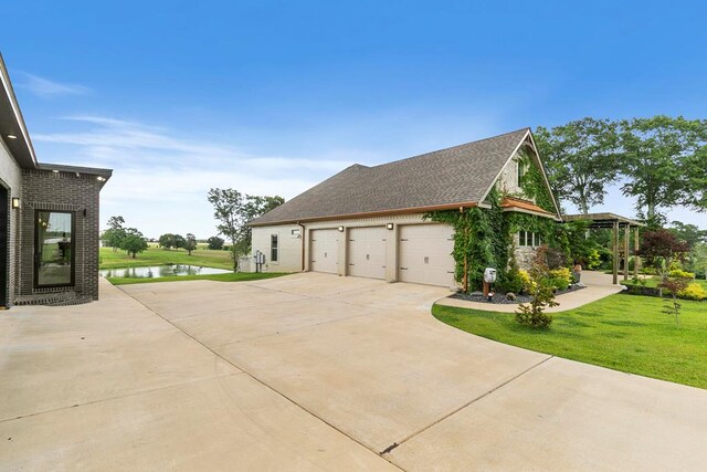 481 Grace Dr, Newton, AL 36352 - view of side of home with concrete driveway, a water view, and a lawn