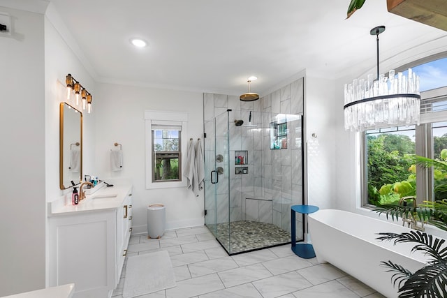 481 Grace Dr, Newton, AL 36352 - bathroom featuring a stall shower, vanity, a soaking tub, baseboards, and crown molding