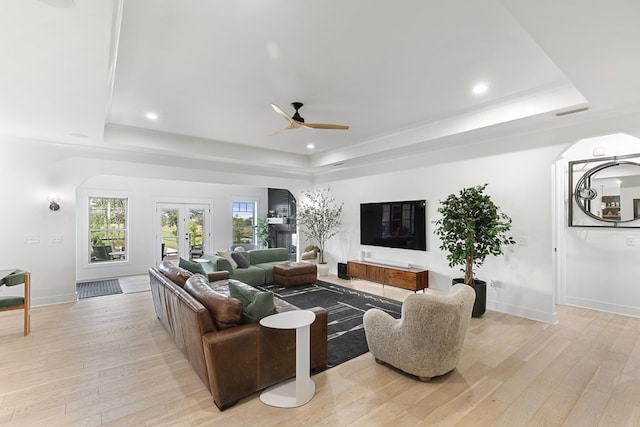 481 Grace Dr, Newton, AL 36352 - living area featuring a tray ceiling, arched walkways, a ceiling fan, light wood-type flooring, and recessed lighting