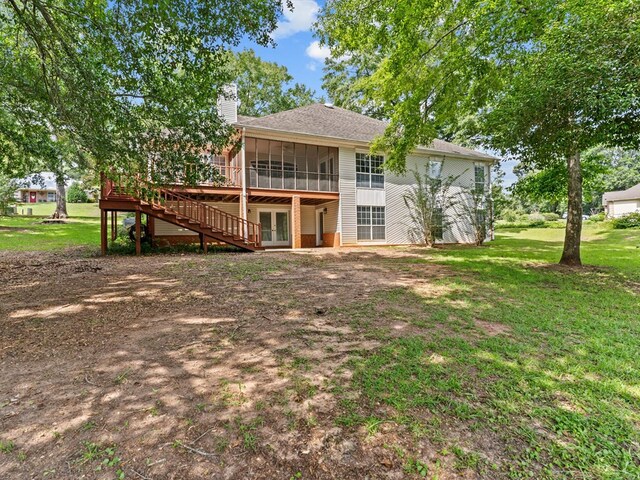3602 Lake Oak Ridge Dr, Enterprise, AL 36330 - rear view of property with french doors, a sunroom, a chimney, a wooden deck, and a lawn