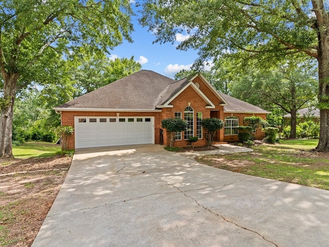 3602 Lake Oak Ridge Dr, Enterprise, AL 36330 - view of front facade with brick siding, an attached garage, concrete driveway, and roof with shingles