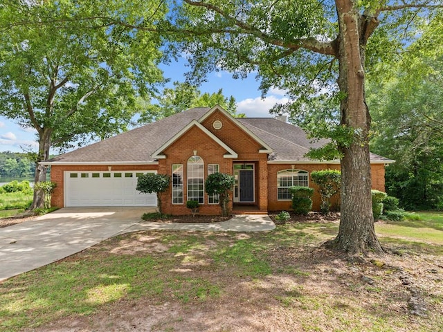 3602 Lake Oak Ridge Dr, Enterprise, AL 36330 - view of front facade featuring concrete driveway, an attached garage, brick siding, and a shingled roof