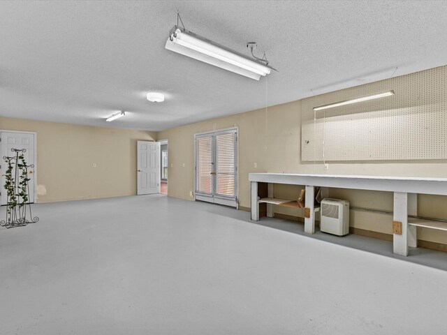 3602 Lake Oak Ridge Dr, Enterprise, AL 36330 - garage with a workshop area and french doors