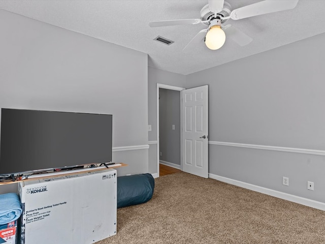 3602 Lake Oak Ridge Dr, Enterprise, AL 36330 - carpeted bedroom featuring ceiling fan, baseboards, and a textured ceiling