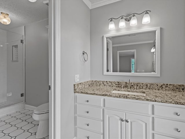3602 Lake Oak Ridge Dr, Enterprise, AL 36330 - bathroom with a shower stall, vanity, toilet, ornamental molding, and a textured ceiling