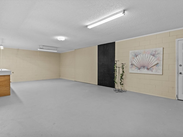 3602 Lake Oak Ridge Dr, Enterprise, AL 36330 - finished basement with concrete block wall and a textured ceiling