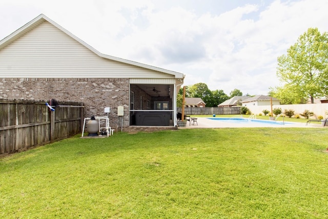 view of yard featuring ceiling fan, a fenced backyard, a fenced in pool, a patio area, and a hot tub