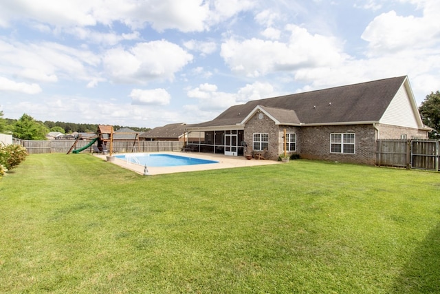 view of pool with a sunroom, a patio area, a fenced in pool, a fenced backyard, and a playground