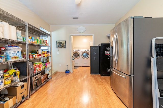 847 Phyllis Ave, Enterprise, AL 36330 - kitchen featuring stainless steel fridge, separate washer and dryer, and light wood-style floors