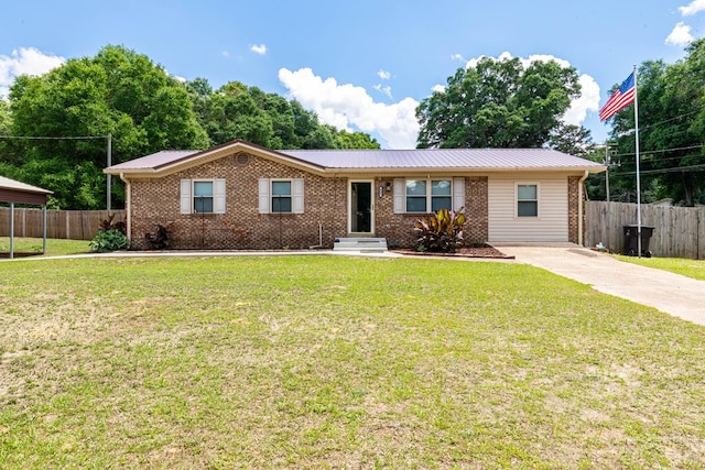 847 Phyllis Ave, Enterprise, AL 36330 - single story home with brick siding, metal roof, and concrete driveway