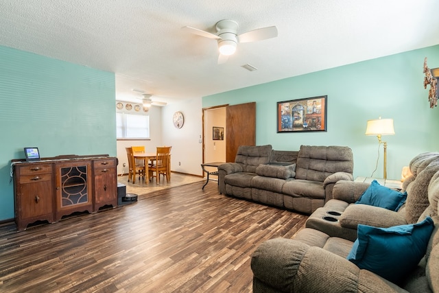 847 Phyllis Ave, Enterprise, AL 36330 - living room featuring ceiling fan, wood finished floors, a textured ceiling, and baseboards