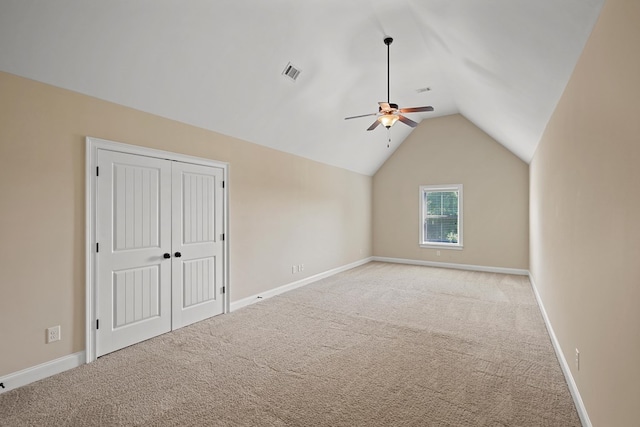 bonus room featuring ceiling fan, vaulted ceiling, and light carpet