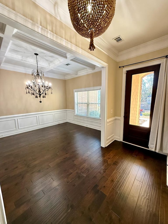 entryway with a healthy amount of sunlight, coffered ceiling, and a chandelier