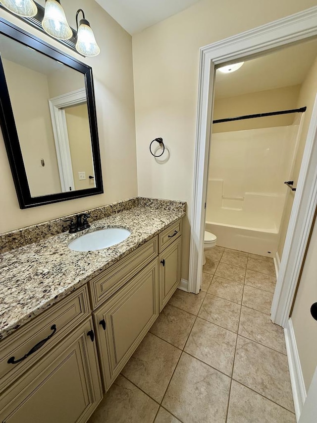 full bathroom featuring vanity,  shower combination, tile patterned floors, and toilet