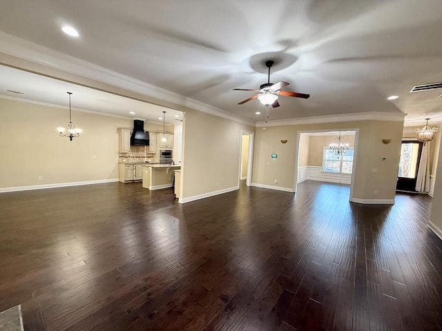 unfurnished living room with dark hardwood / wood-style flooring, ceiling fan with notable chandelier, and ornamental molding