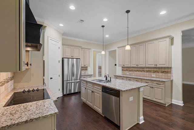 kitchen featuring pendant lighting, tasteful backsplash, light stone counters, stainless steel appliances, and a center island with sink