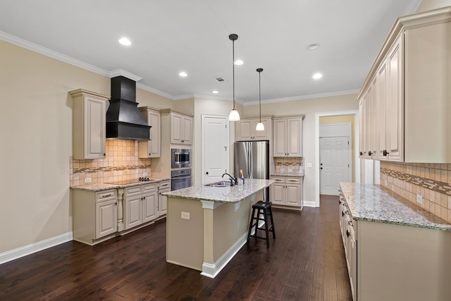 kitchen with premium range hood, hanging light fixtures, a kitchen island with sink, black appliances, and light stone countertops